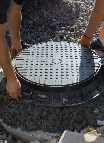 A,Cast,Iron,Sewer,Installed,In,Concrete,Well,,Preparation,For